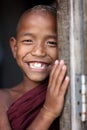 Smiling young Buddhist novice in Mandalay, Myanmar