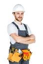 Smiling young builder, looking at camera. Repair and construction. Isolated over white background. Royalty Free Stock Photo