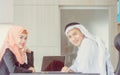 Smiling young business arab middle eastern meeting working in office and looking at camera Royalty Free Stock Photo