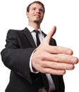 Smiling young business man giving hand for handshake Royalty Free Stock Photo