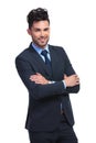 Smiling young business man standing with arms folded Royalty Free Stock Photo