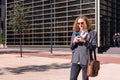 smiling young business man using mobile phone Royalty Free Stock Photo