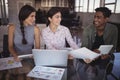 Smiling young business people working together at office Royalty Free Stock Photo