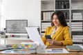 Smiling young business woman, happy beautiful professional lady worker holding smartphone using cellphone mobile working Royalty Free Stock Photo