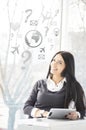 Smiling young business woman with tablet PC at her office and signs Royalty Free Stock Photo