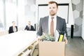 Smiling Young Businessman Quitting Job