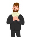 Smiling young businessman showing or holding cash, money, currency notes, dollars or banknotes in hands. Business, finance. Royalty Free Stock Photo