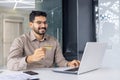 Happy businessman shopping online with credit card Royalty Free Stock Photo