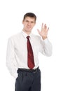 Smiling young businessman with a welcoming gesture Royalty Free Stock Photo