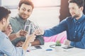 Smiling young businessmen drinking water and discussing new project business Royalty Free Stock Photo