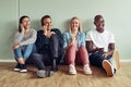 Smiling young businesspeople using cellphones during their offic Royalty Free Stock Photo