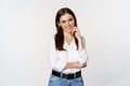 Smiling young businesswoman, female entrepreneur in white shirt, cross arms on chest like professional, standing over