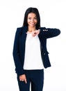 Smiling young businesswoman pointing finger away Royalty Free Stock Photo