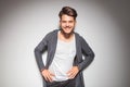 Smiling young casual man with hands on waist Royalty Free Stock Photo