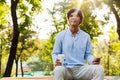 Smiling young casual man holding mobile phone Royalty Free Stock Photo