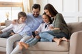 Happy family with kids use cellphone at home Royalty Free Stock Photo