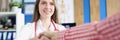 Smiling young caucasian female doctor shaking hands with greeting and meeting patient at hospital Royalty Free Stock Photo