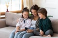 Happy mom use cellphone with two kids Royalty Free Stock Photo