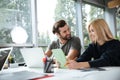 Smiling young colleagues sitting in office coworking Royalty Free Stock Photo