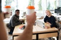 Smiling young colleagues sitting in office coworking Royalty Free Stock Photo