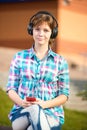 Smiling young college girl texting on a cell phone Royalty Free Stock Photo