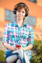 Smiling young college girl texting on a cell phone Royalty Free Stock Photo