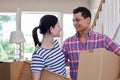 Young Couple Carrying Boxes Into New Home On Moving Day Royalty Free Stock Photo