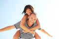 Smiling young couple having fun at the beach Royalty Free Stock Photo