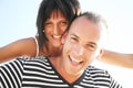 Smiling young couple having fun at the beach Royalty Free Stock Photo