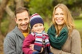 Smiling young couple with little boy posing Royalty Free Stock Photo