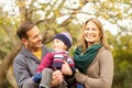 Smiling young couple with little boy posing Royalty Free Stock Photo