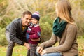 Smiling young couple with little boy posing Royalty Free Stock Photo