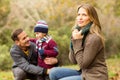 Smiling young couple with little boy posing Royalty Free Stock Photo