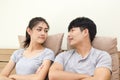 Smiling young couple looking at each other face on the bed Royalty Free Stock Photo