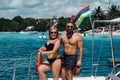 Smiling young couple looking at each other, standing on board the yacht Royalty Free Stock Photo