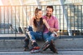 Smiling young couple on rollerblades. Royalty Free Stock Photo