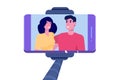 Smiling young Couple selfie on smartphone. Selfie stick monopod.