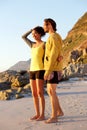 Smiling young couple standing at the beach Royalty Free Stock Photo