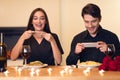 Smiling young couple taking picture of food Royalty Free Stock Photo