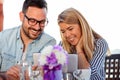 Smiling young couple using a tablet in cafe Royalty Free Stock Photo