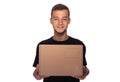 Smiling young delivery man holding and carrying a cardbox. Royalty Free Stock Photo