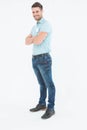 Smiling young delivery man standing arms crossed Royalty Free Stock Photo