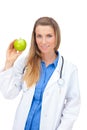 Smiling young doctor giving an green apple. Royalty Free Stock Photo