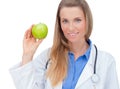 Smiling young doctor giving an green apple. Royalty Free Stock Photo