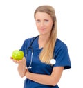 Smiling young doctor giving an green apple. Royalty Free Stock Photo