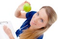 Smiling young doctor giving an green apple. Royalty Free Stock Photo