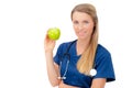 Smiling young doctor giving an green apple. Royalty Free Stock Photo