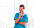 Smiling young doctor isolated in hospital Royalty Free Stock Photo