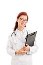 Smiling young doctor with a stethoscope holding a clipboard Royalty Free Stock Photo