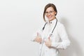 Smiling young doctor woman with stethoscope, glasses isolated on white background. Female doctor in medical gown Royalty Free Stock Photo